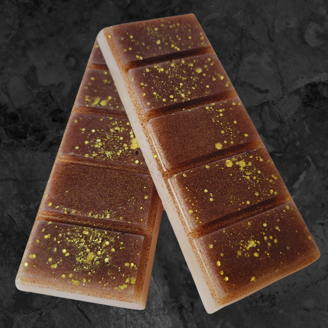 Brown and cream soy wax snap bar melt with chunky gold biodegradable glitter dispersed throughout.