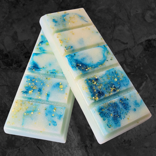  Sea salt & driftwood soy wax snap bar melt. Blue and cream coloured wax with gold bio glitter throughout.