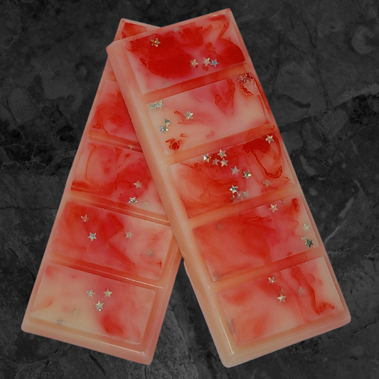 Peppermint Candycane soy wax snap bar melt. Cream and red wax with silver star bio glitter throughout.